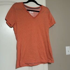 Women’s orange Nike v-neck workout top